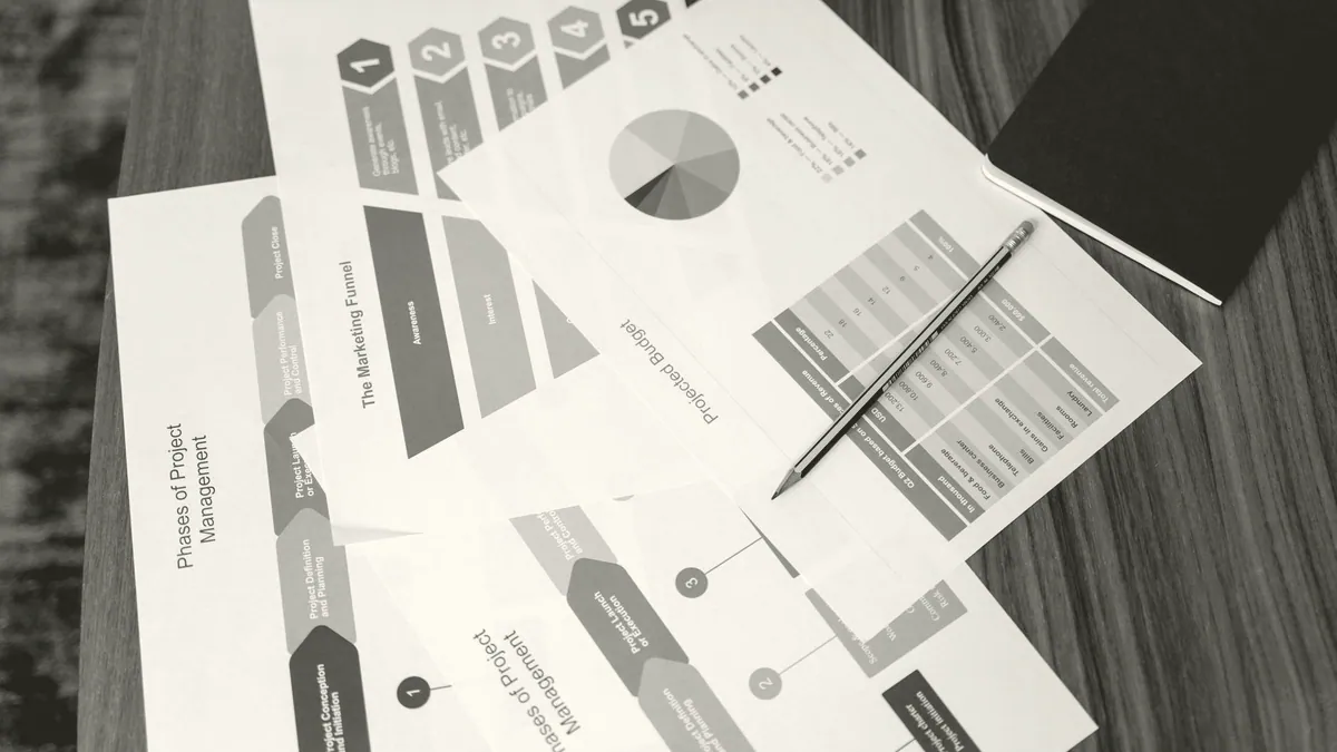 Printed charts on a desk.