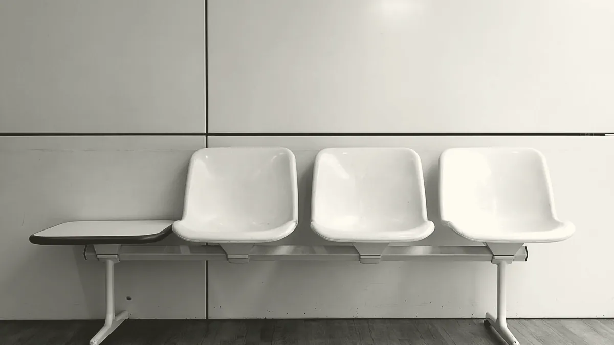 Empty chairs in a waiting room.