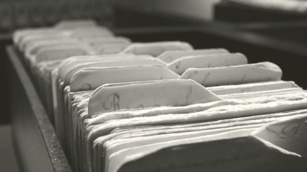 Index cards in a filing box.