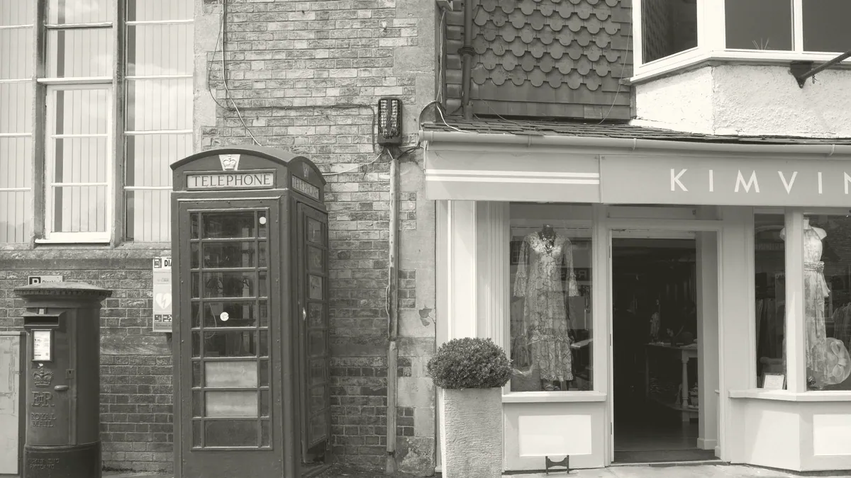 A row of shopfronts on a high street.