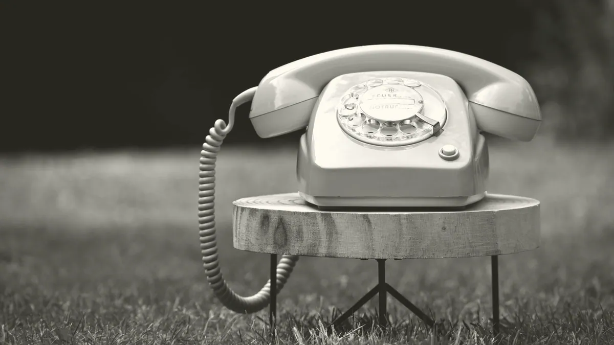 A telephone on a hall table.