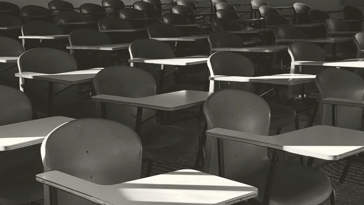 Chairs set out in a circle in an empty room.
