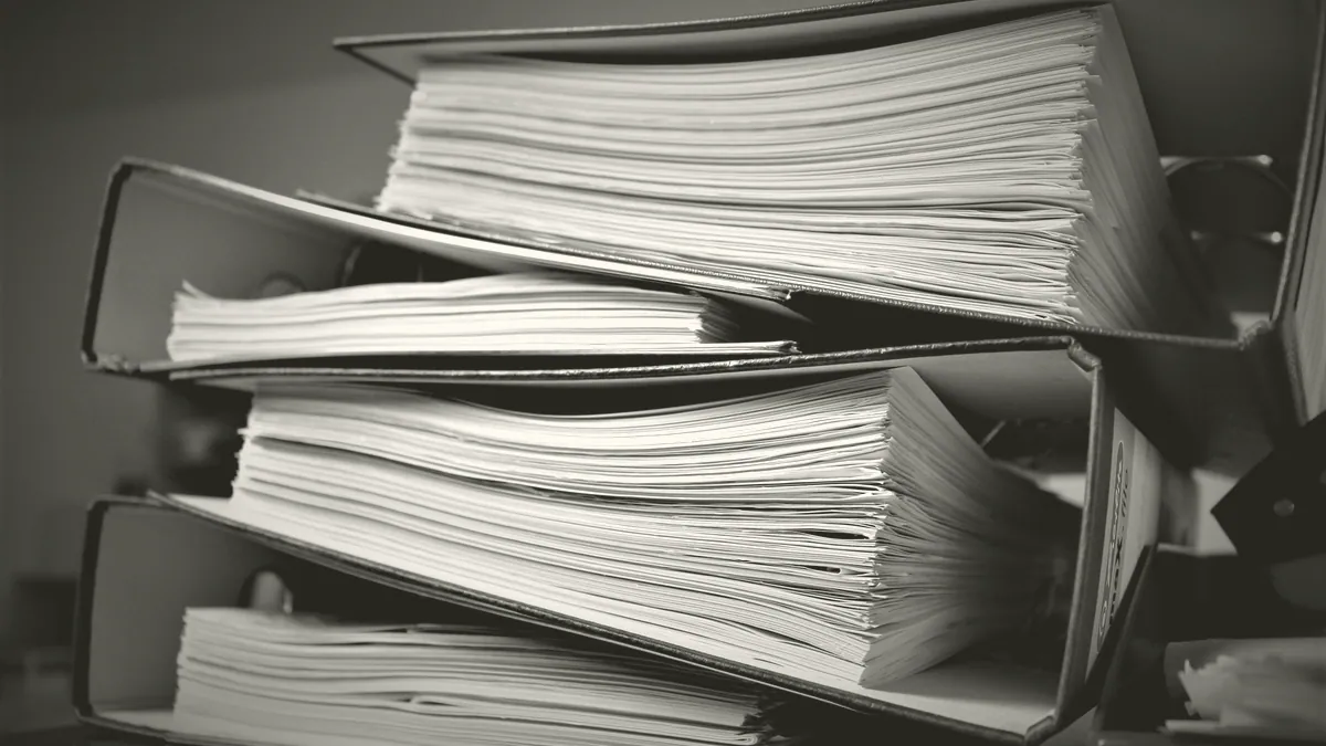 A printed document in a folder.