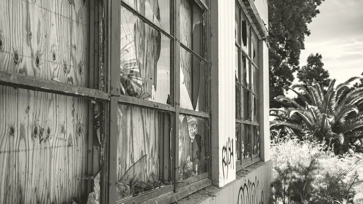 A boarded window.