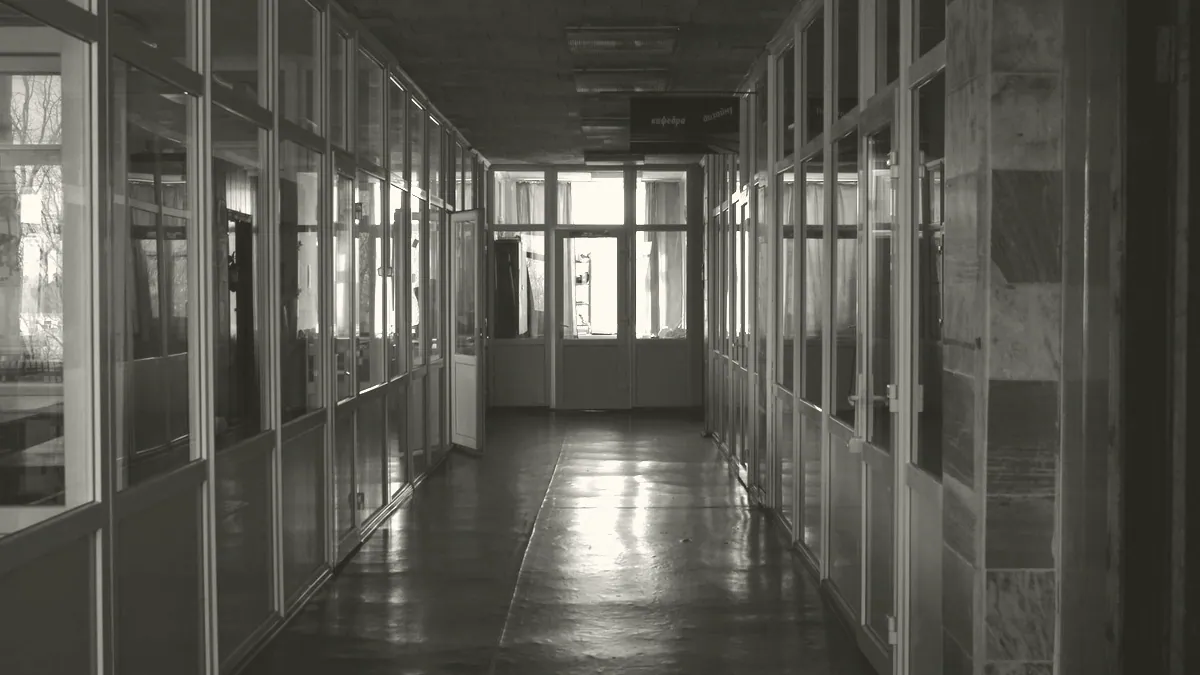 A closed door along a corridor.
